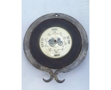 An unusual glass domed barometer with the centre image depicting an Edwardian Panhard motor car, it has a leather material 'i