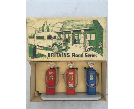 An early boxed Britains set of petrol pumps, no. 102V, Esso, Mobilgas and Fina.