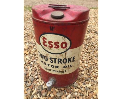 An Esso two stroke mixing oil five gallon drum with dispensing tap.