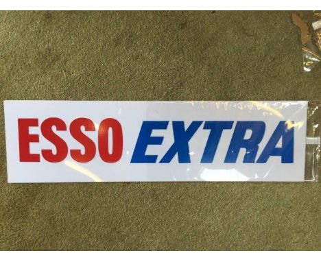 A pair of original new old stock Esso Extra plastic petrol pump panel insert signs. 