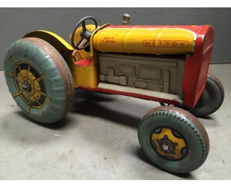A Mettoy clockwork tinplate model of a pre-war tractor.