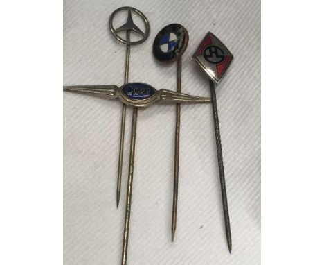 Four Continental stick pins including Opal, Mercedes-Benz and BMW.