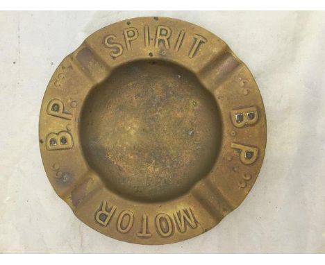 A BP Motor Spirit brass ashtray.