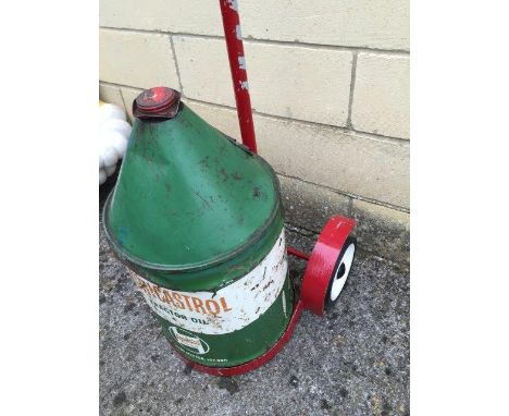 An Agri-Castrol Tractor Oil five gallon cylindrical, conical drum on a forecourt trolley.