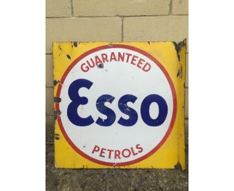 An Esso Guaranteed Petrols double sided enamel sign with hanging flange, 22 x 22".
