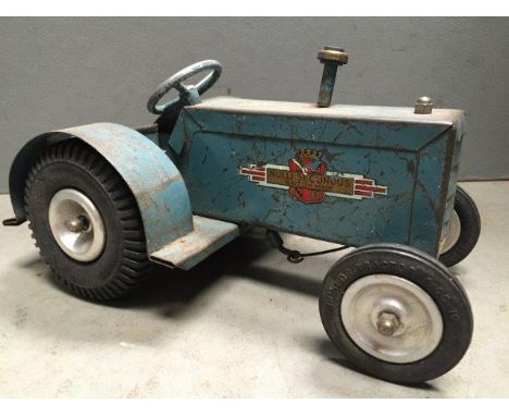 A tinplate model of a pre-war tractor marked Nulli Secundus, British made. 
