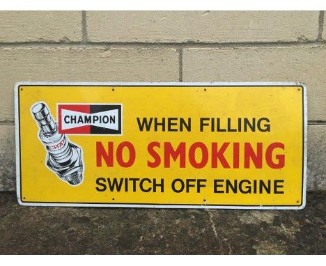 A Champion Spark Plugs rectangular aluminium advertising sign 'When filling switch off engine', 23 x 10".