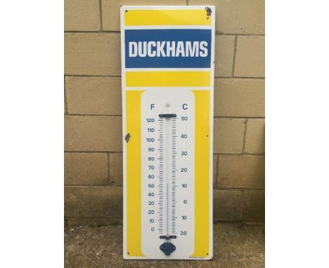 A Duckham's blue and yellow enamel thermometer by Burnham of London.