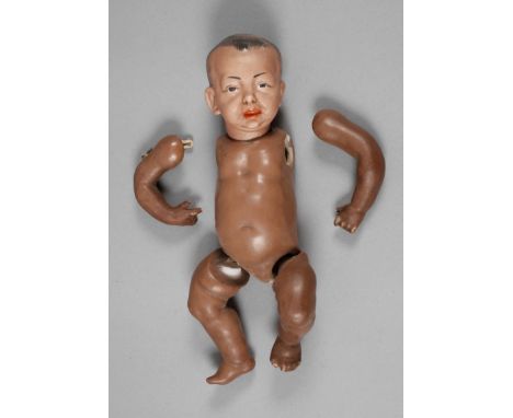 Kämmer &amp;amp; Reinhardt Porzellankopfpuppe als sogenannte "Negerpuppe", um 1909, gemarkt 28 K Stern R 100, Biskuitporzella