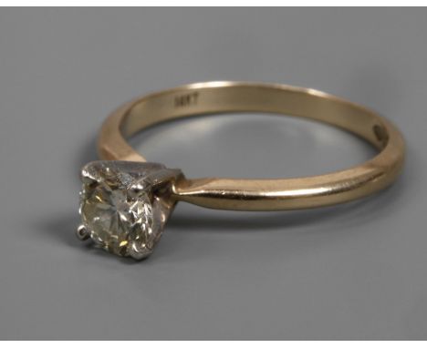 Solitärring mit Brillant von ca. 0,5 ctneuzeitlich, Weiß- und Gelbgold gestempelt 14 K = 585/1000, besetzt mit einem Brillant
