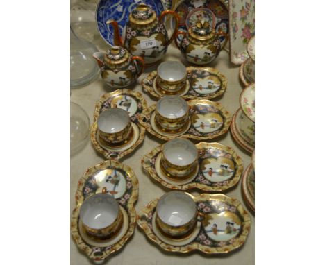 Oriental Ceramics - a Japanese six-setting eggshell porcelain tea set, decorated in the typical taste, comprising teapot, mil