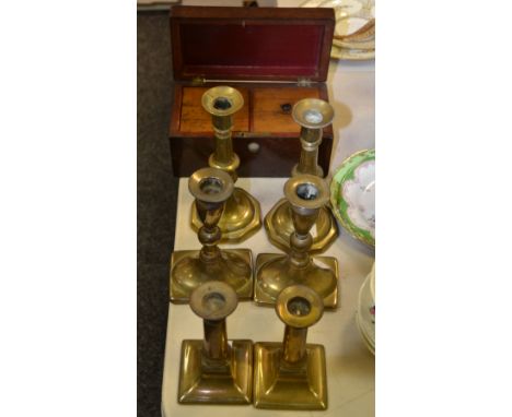 A George III mahogany two section tea caddy, mother of pearl escutcheon (faults); a pair of Georgian brass candlesticks, othe