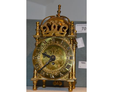 A brass lantern clock, Roman numerals, by Smiths Clocks and Watches , Great Britain