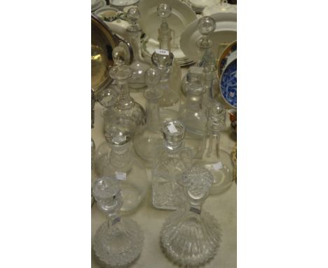 A Victorian cut glass globular decanter; a Victorian glass decanter and stopper, acid etched with ferns; others, similar; oth