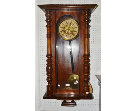 A late 19th century Vienna wall clock, arched clear glass door, the dial with Art Nouveau embossed brass panel, twin winding 