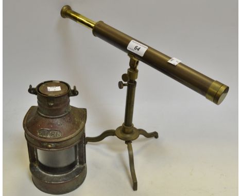 A Hong Kong junk stern copper light; a brass 3 draw telescope Stanley of London, on a tripod base (2)