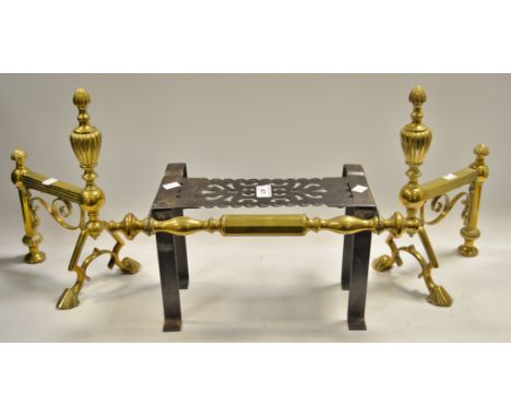 A pair of Art Nouveau brass fire dogs; a brass and cast iron trivet