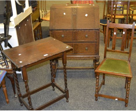 An oak fall front bureau, the front enclosing pigeon holes c.1930; an oak occasional table, barley twist supports, pie crust 