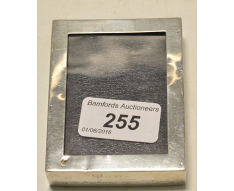 A George V silver rectangular paperweight/photograph frame, inscribed I Will Go In The Strength of the Lord - Andrew Montague