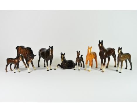 A group of eight Beswick horses and foals.