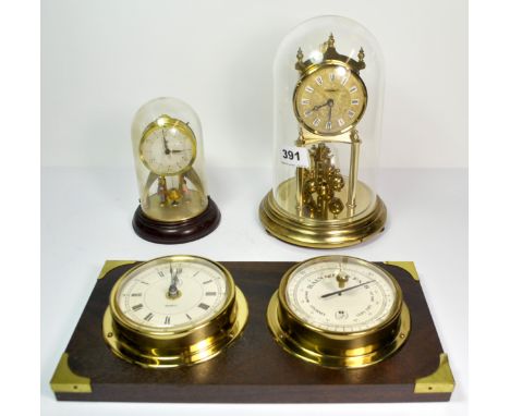 Two anniversary clocks and a wall mounted clock and barometer.
