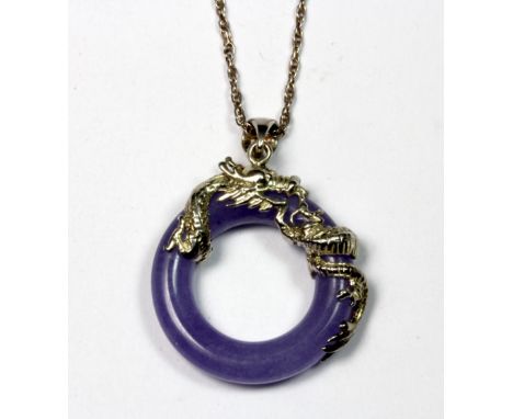 A lavender jade and silver pendant and chain.