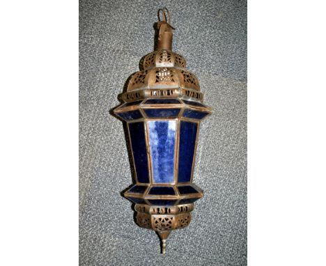 An Eastern style metal and blue glass light fitting, H. 55cm.