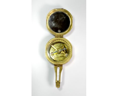 A brass compass.