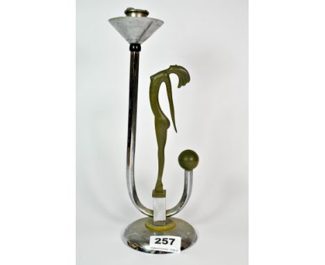 An Art Deco chrome and painted figural candlestick, H. 28cm.