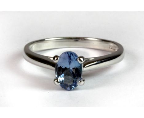 A 9ct white gold ring set with a 1ct oval cut light blue tanzanite (M.5).