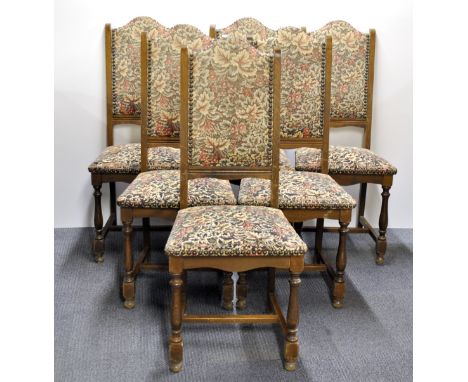 A set of six tapestry upholstered dining chairs.