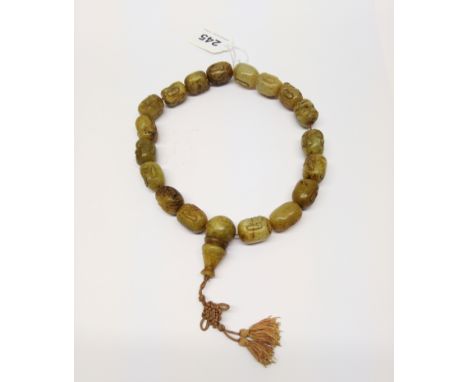 A string of Chinese carved jade / hardstone Lohan head prayer beads, each bead approx. 2.5cm.