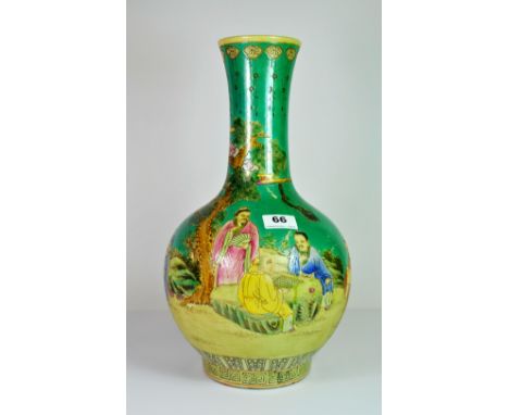 A fine Chinese hand enamelled porcelain bottle vase painted with five figures playing a board game beneath a pine tree, H. 41