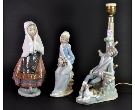 A Lladro table lamp and two Lladro figures, lamp H. 34cm