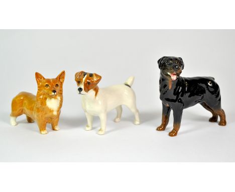 Three Beswick dog figures.