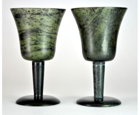 A pair of Chinese spinach jade wine cups, H. 10cm.