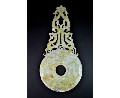 A Chinese carved jade dragon mounted pi disc, L. 30cm.