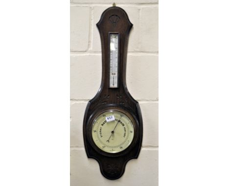 A carved oak barometer and thermometer, H. 82cm.