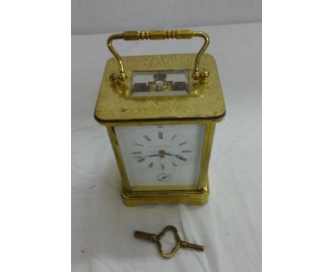 Matthew Norman London Swiss Made 8 Day Carriage Clock, numbered 1755 with alarm mechanism, striking on a gong, polished brass