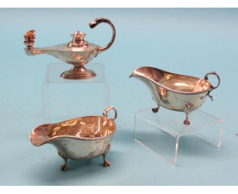 A pair of silver sauce jugs, bead borders and claw feet, London 1916, approx. 7oz. total, and an Edward VII silver oil lamp w
