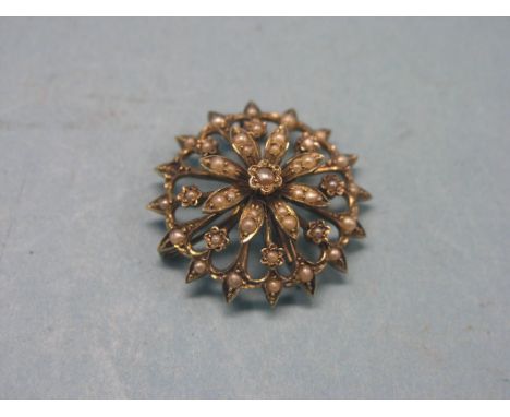 An Edwardian 9ct. gold and seed-pearl brooch, circular-shape, numerous seed pearls
