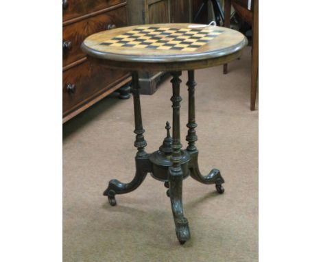 A Victorian burr walnut games table, circular top with inlaid chess-board, on turned tripod underframe with carved terminals 