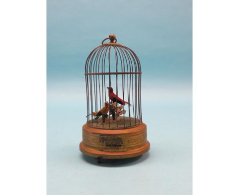 A brass musical bird cage automaton, two singing birds, integral key, 12in. high