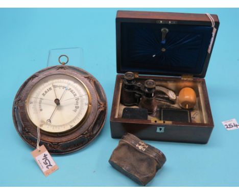 A Victorian rosewood box, contents include two brooches, two pairs of opera glasses, also to include an oak aneroid barometer