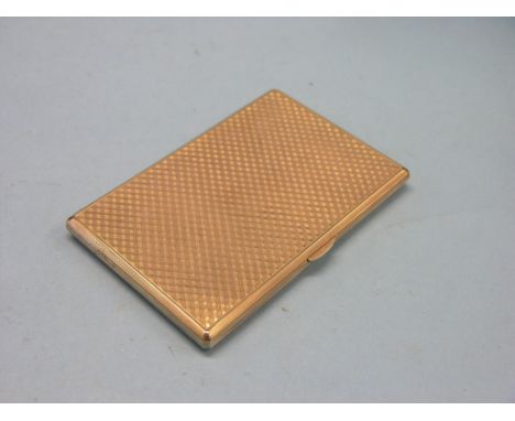 An engine-turned 9ct. gold cigarette case, London 1959, 176.4 grams