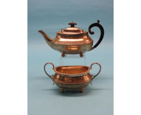 A silver teapot, with gadrooned border, W. Hutton, London 1910, and a silver two-handled gadrooned-pattern sugar bowl, Sheffi