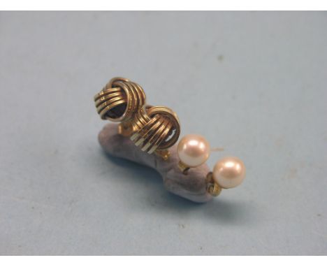 A pair of yellow metal ear-rings, knotted design, 3.7 grams total, and a pair of pearl-type ear-rings, 9ct. gold mounts 
