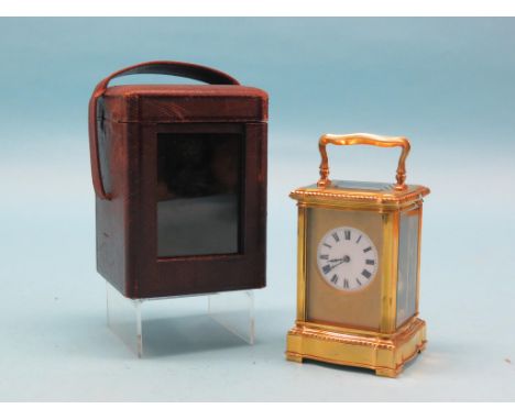 An early 20th century French carriage clock, with enamelled dial, unsigned Paris movement with compensated balance and striki