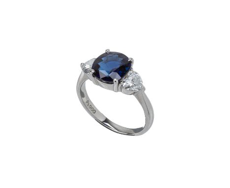 A SAPPHIRE AND DIAMOND THREE STONE RING
Set in platinum, the central blue sapphire flanked by two heart shaped diamonds
Marke