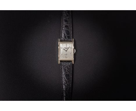 A LONGINES WHITE GOLD DIAMOND SET WATCH
In 14k white gold rectangular case, the 17 jewel manual wind movement signed and numb